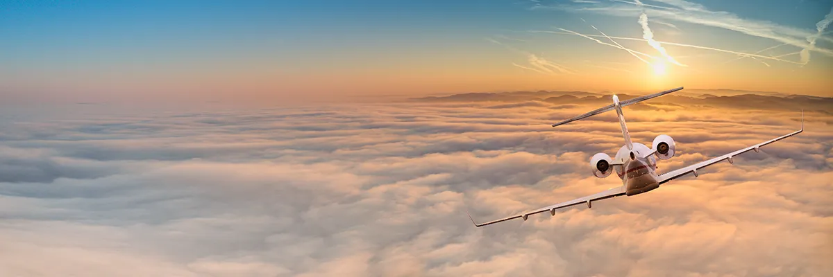 private jet above the clouds
