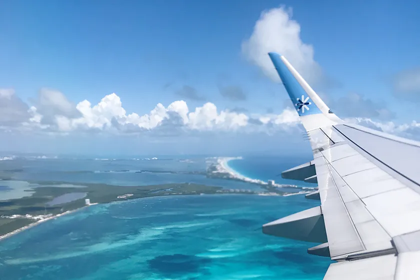 private jet over the ocean