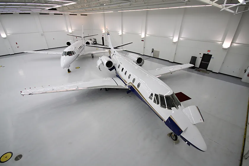 private jets in a hanger