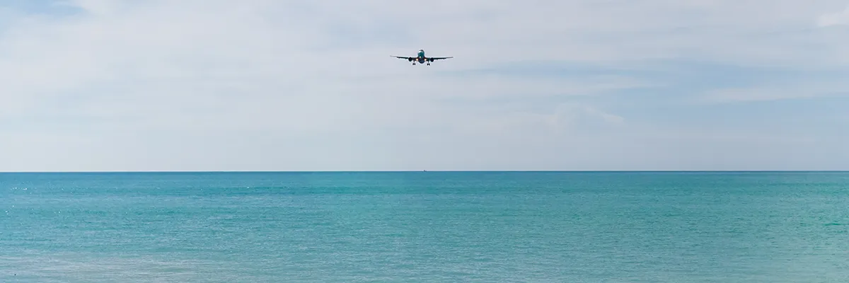 private jet over the ocean