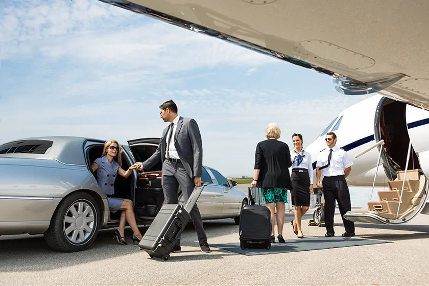 business professionals boarding a private jet
