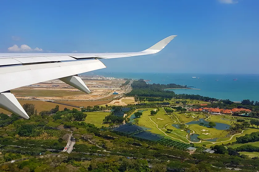 private plane over a golf course